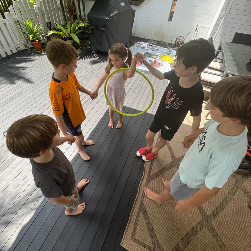 Kids playing a game at their private home camp