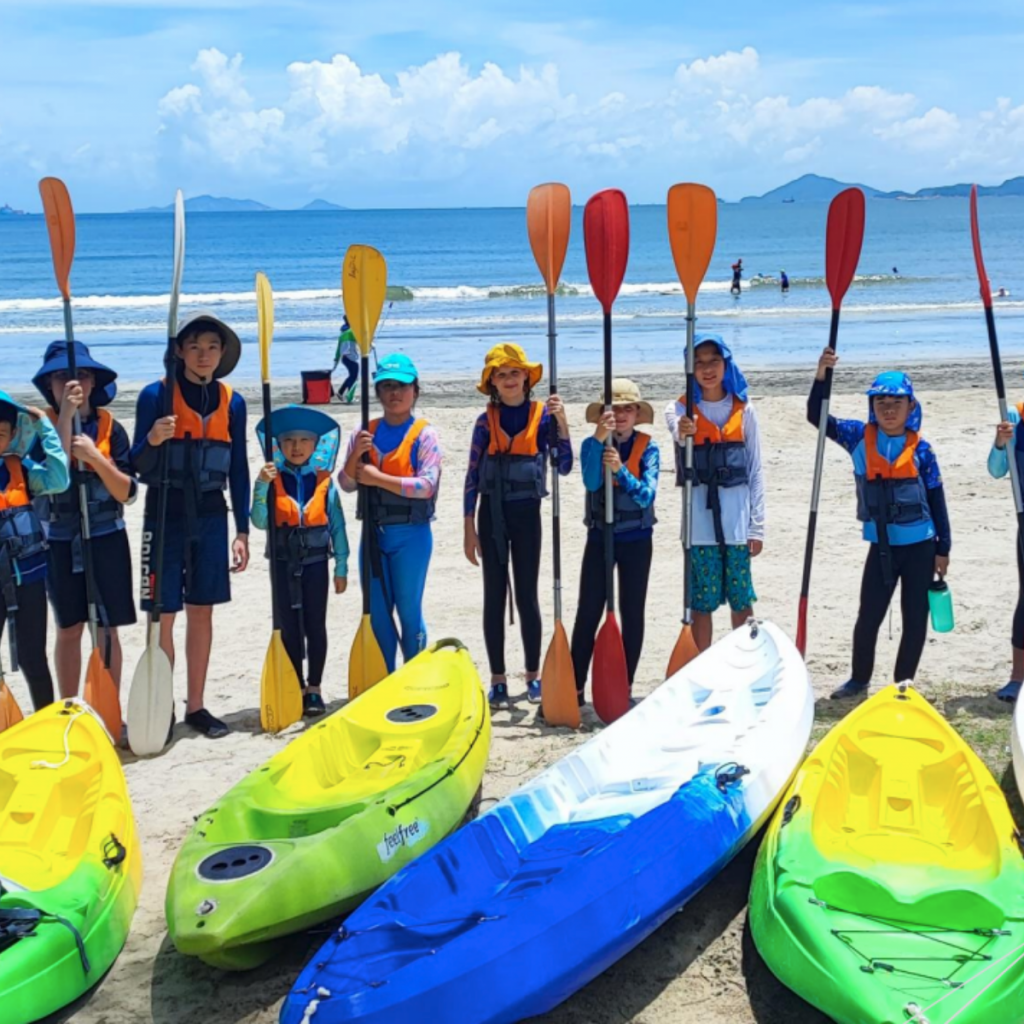 Kids going kayaking during adventure camp